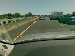 fire truck passing on highway shoulder